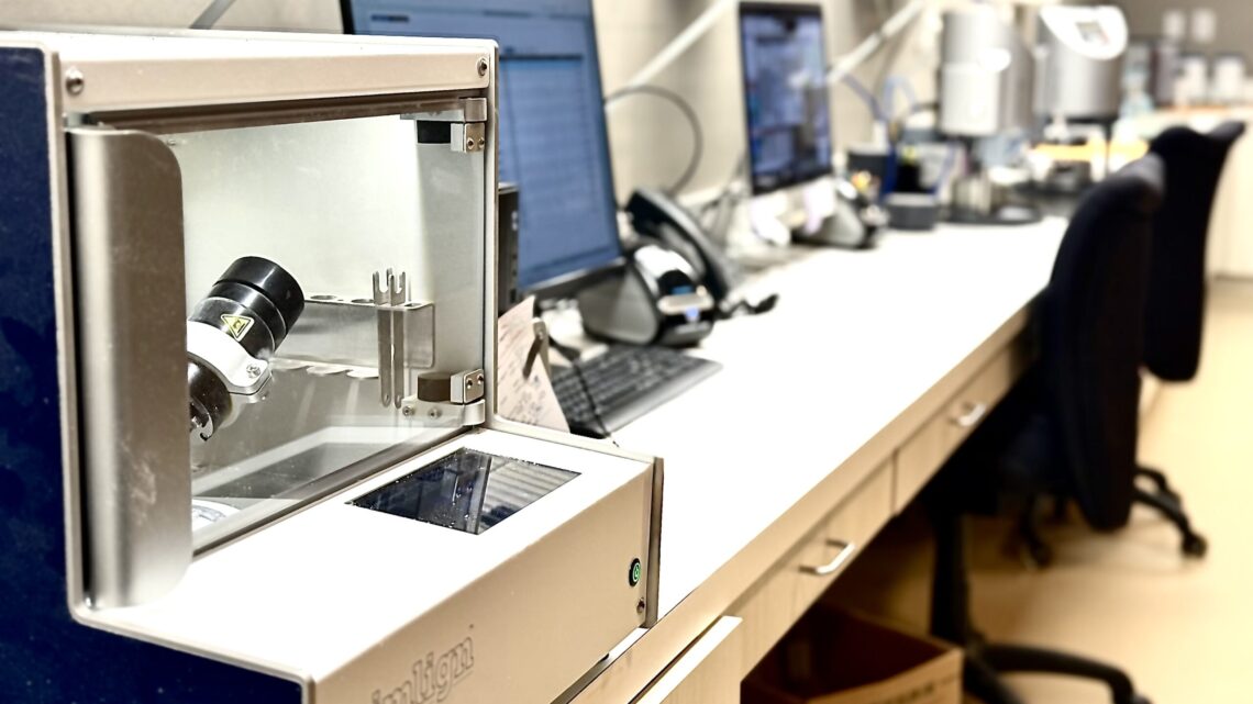 Lab workstation with analytical instrument and monitors