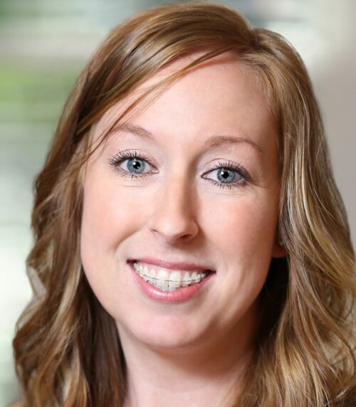 Close-up smiling woman with wavy blonde hair